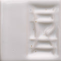 Close-up of a textured white ceramic tile